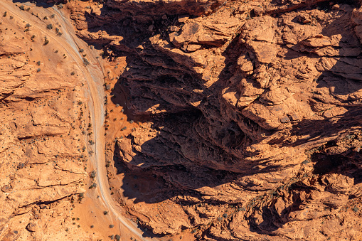 Aerial view of a wash in Southern Nevada featuring jagged Mars or alien like rock formations