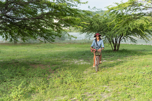 Young Woman with bicycle on her way to the park