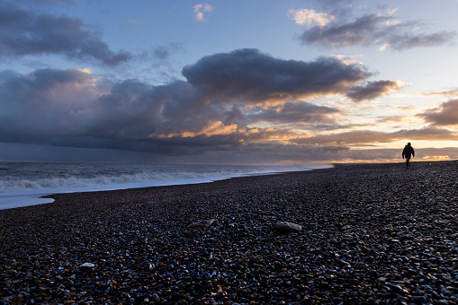 An early morning stroll on the gravel beach if Cley next the sea in Norfolk