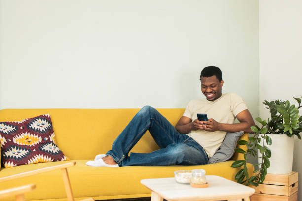 istock Shot of a young man using his smartphone 1823397972