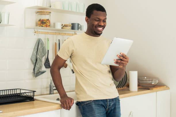 istock Shot of a young man using his digital tablet 1823397981