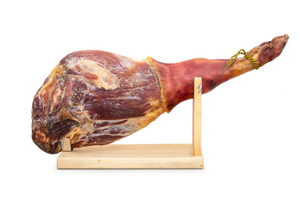 istock Whole jamon on wooden stand isolated on white background 1823399652