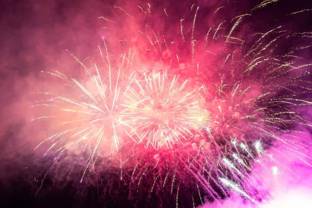 istock bright pink beautiful salute in the night sky at event 1823399656