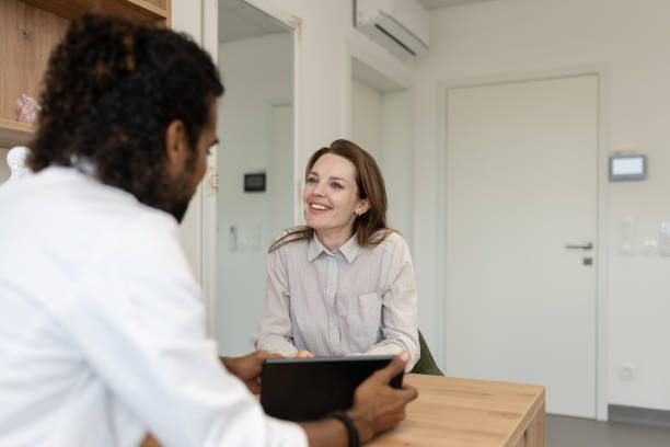 istock A doctor, a dentist and a patient at a desk. 1823400165