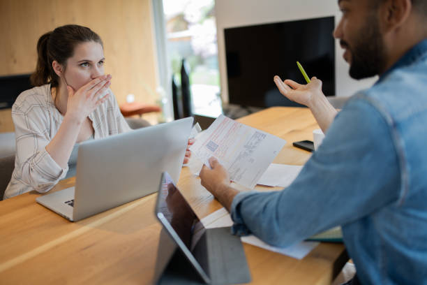 istock Multiracial couple paying bills online 1823403974