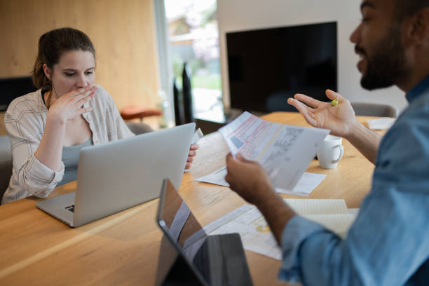 istock Multiracial couple paying bills online 1823404442