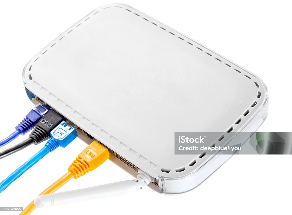 white wlan router with colorful pluggeg in cables "wlan router, isolated on white" Bandwidth Stock Photo