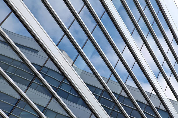 Blue sky reflected in a modern building glass facade
