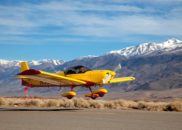 光スポーツ航空機 - airplane stunt yellow flying ストックフォトと画像