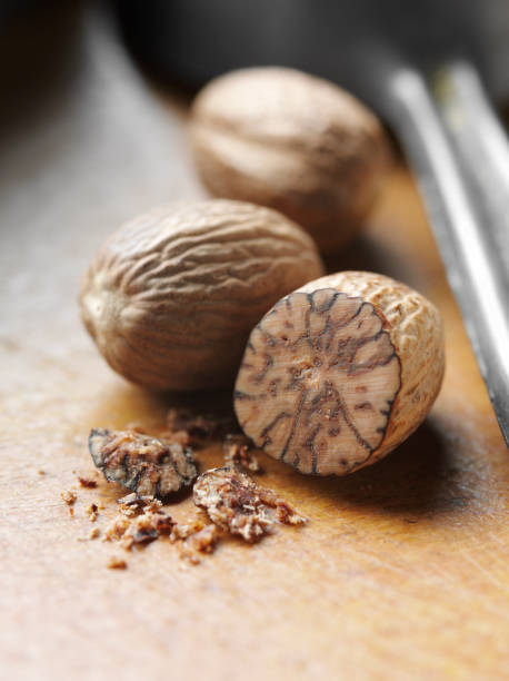 Nutmeg on a Wooden Board stock photo