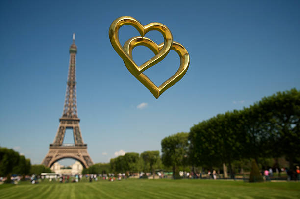istock Two Golden Hearts Together above Eiffel Tower 182349523