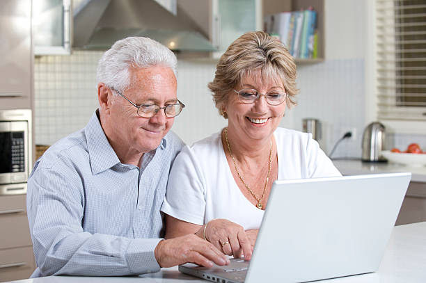 istock Senior couple with computer laptop 182351897