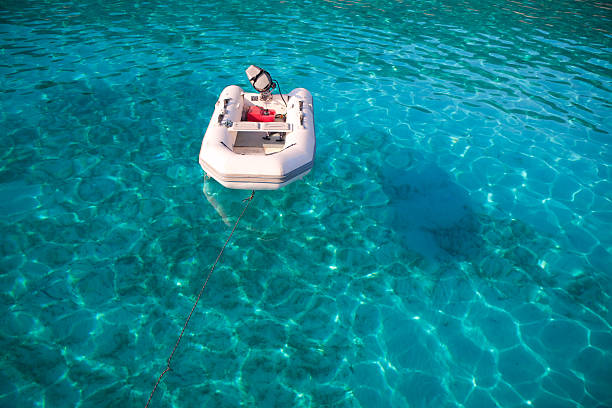 istock Turquoise sea background and tender boat 182351901