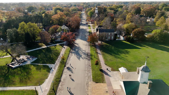Autumnal Duke of Gloucester Street in Colonial Williamsburg, Virginia. Aerial footage with forward camera motion