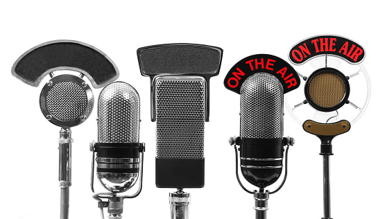 Five interview microphones isolated on white.