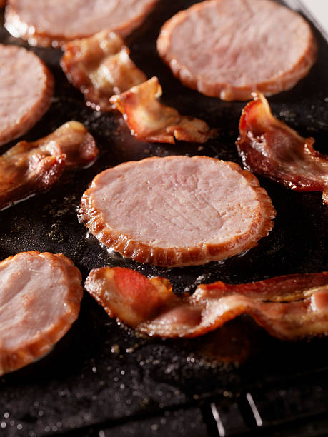 istock Ham and Bacon Frying on The Grill 182353005