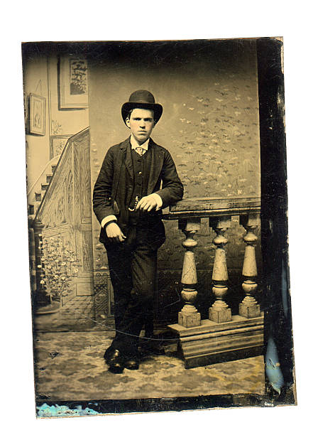 Vintage tintype photograph of a young victorian man from the 1860's 1870's wearing a bowler hat