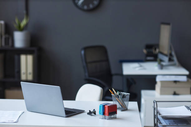 istock Workplace of worker of modern visa application center with laptop 1823542820