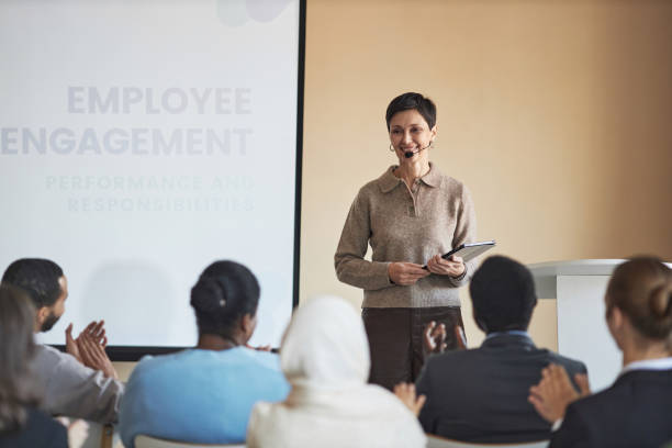 istock Happy experienced coach with tablet looking at audience with smile 1823543510