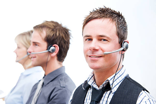 Call Center Employees Using Headsets Customer Service stock photo