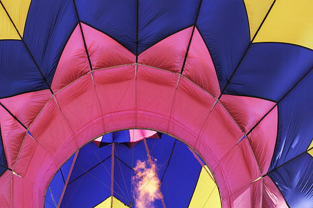 Colorful hot air balloon flying above the clouds