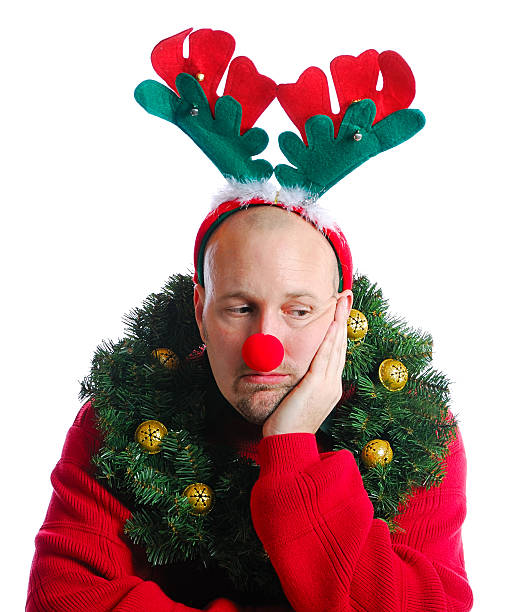 istock A depressed man dressed up for Christmas 182355646