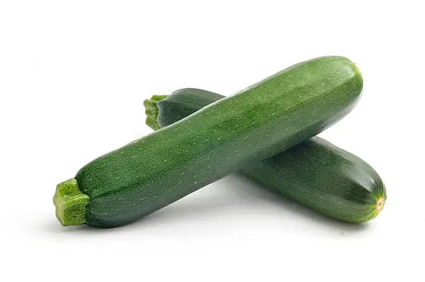 Two courgettes isolated on white.