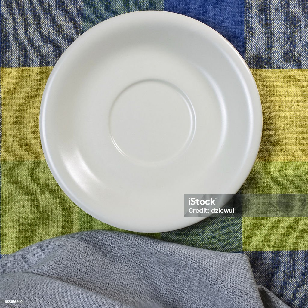 Empty white plate on wooden table Backgrounds Stock Photo