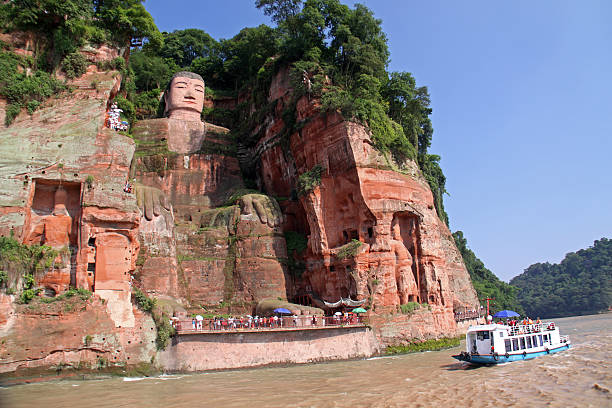 Leshan Giant Budha One of the world's largest budga statue in Leshan, Sichuan, China (it is carved out of mountain and 71 meter tall) monastery religion spirituality river stock pictures, royalty-free photos & images