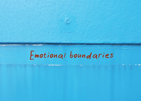 Text of copy space blue background Emotional Boundaries  -  frontier and bounding line which gives one sense of entitlement - personal space and privacy to conserve emotional energy and control emotions