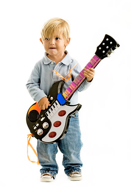 istock child with electric guitar 182356432