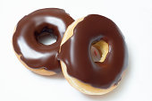 Two Chocolate Donuts Isolated on a White Background