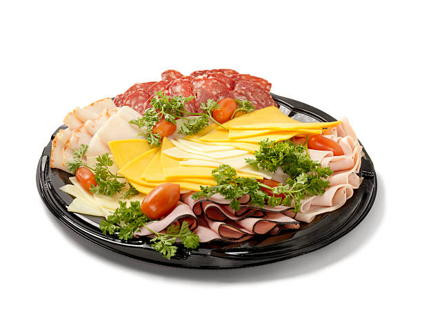 Deli Meat and Cheese Party Tray Deli Meat and Cheese Party Tray-Photographed on Hasselblad H3D2-39mb Camera cold cuts meat photos stock pictures, royalty-free photos & images