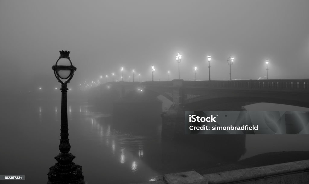 London In The Fog "A blanket of fog hangs over London, giving it a real Film Noir atmosphere. The lights of Battersea Bridge are reflected in the dark waters below." Fog Stock Photo