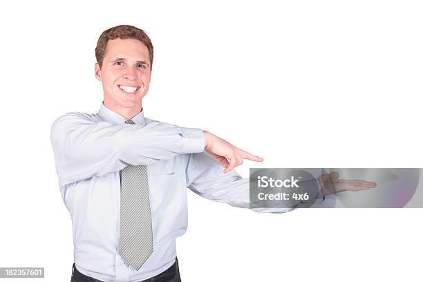 Businessman Pointing At Product In Hand Stock Photo - Download Image Now - Adult, Adults Only, Beautiful People