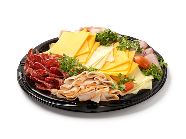 Deli Meat and Cheese Party Tray Deli Meat and Cheese Party Tray-Photographed on Hasselblad H3D2-39mb Camera tray stock pictures, royalty-free photos & images