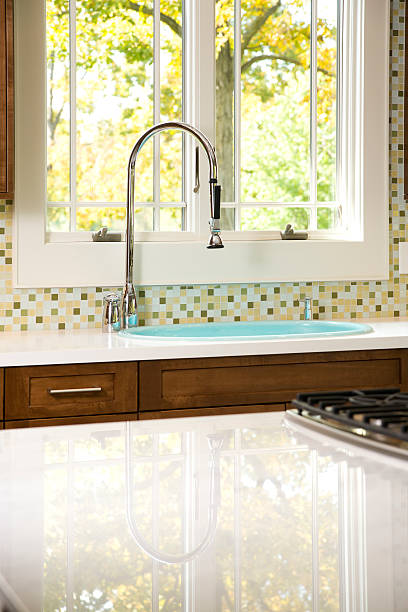 istock Bright kitchen window, faucet and sink. 182358459