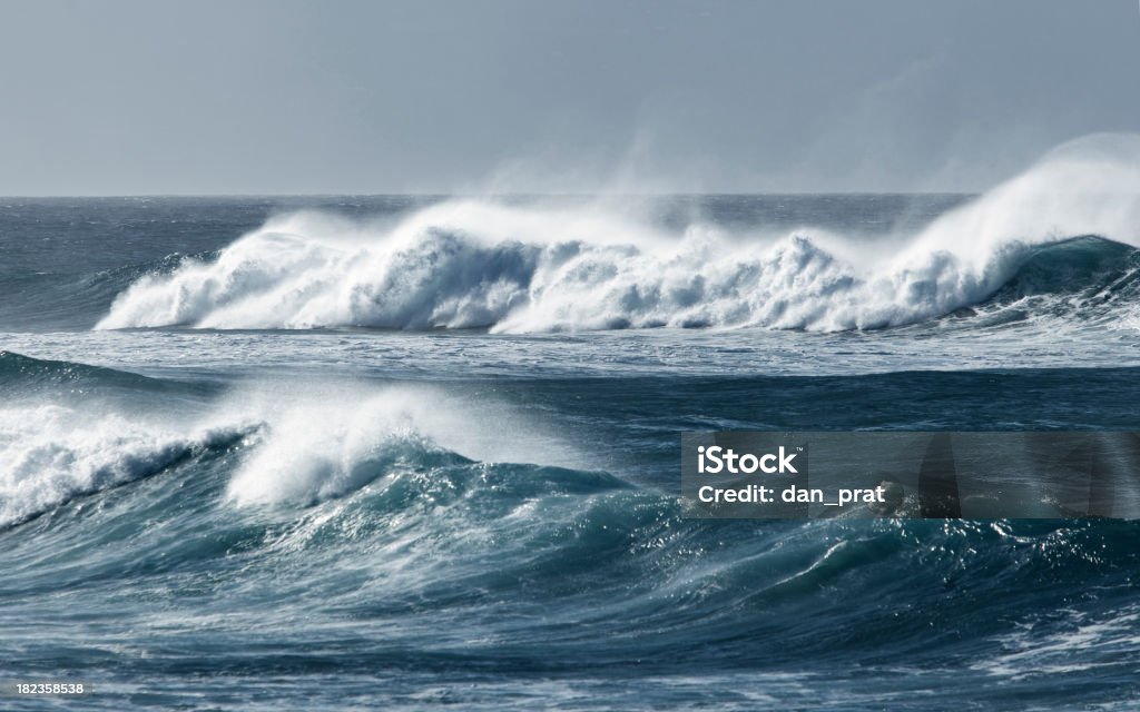 Rolling Waves Large ominous waves rolling into shore. Sea Stock Photo