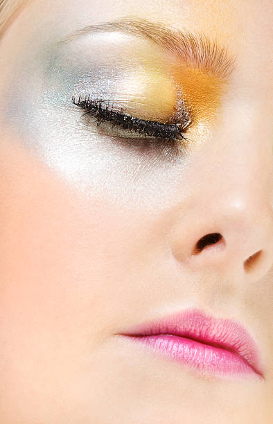 istock close up of face with multicolored make-up 182358575