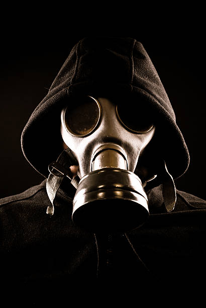 istock Hooded man in gas mask 182358856