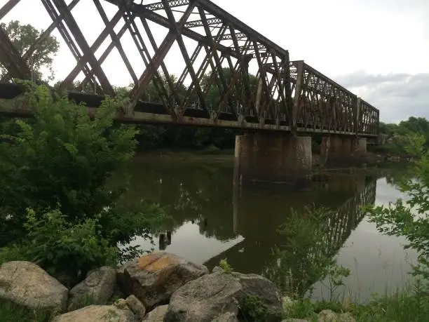 Manhattan Rail Bridge with River Reflection in Manhattan, Kansas