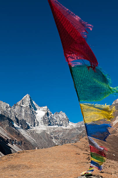 istock Colorful prayer flags Himalayan mountain summits deep blue sky Nepal 182359953
