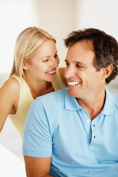 istock Cute romantic couple sitting together 182360035