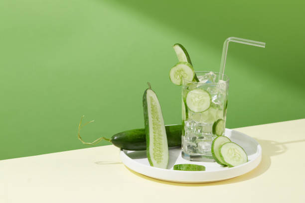 istock A glass containing fresh cucumber slices and ice is placed on a white ceramic plate. Cucumbers contain 95% - 97% water combined with minerals to help replenish and retain water for the body. 1823601891