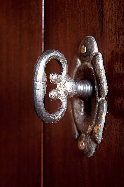 istock Old ornate antique lock and keyon medieval door 182360373