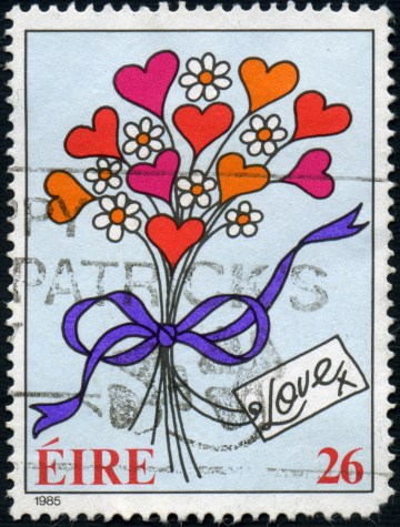 A 26 pence Irish postage stamp issued in 1985 with a stylized bouquet of hearts and flowers.