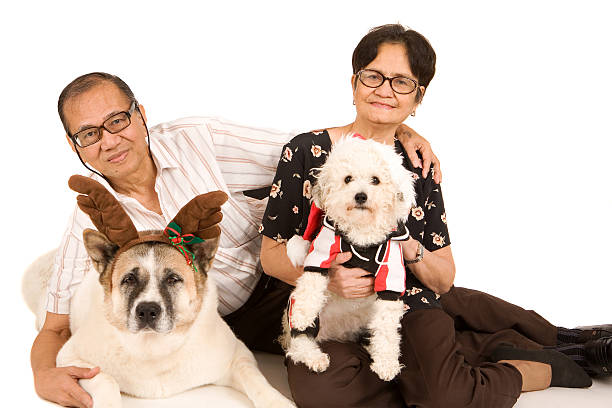 An asian couple with there pets. Please view these along with all