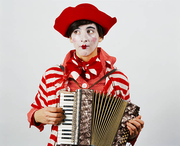 Female clown playing the accordion