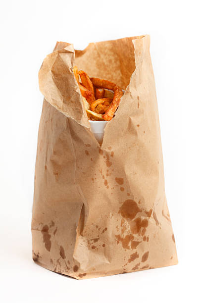 A bag of fast food showing oil stains.
