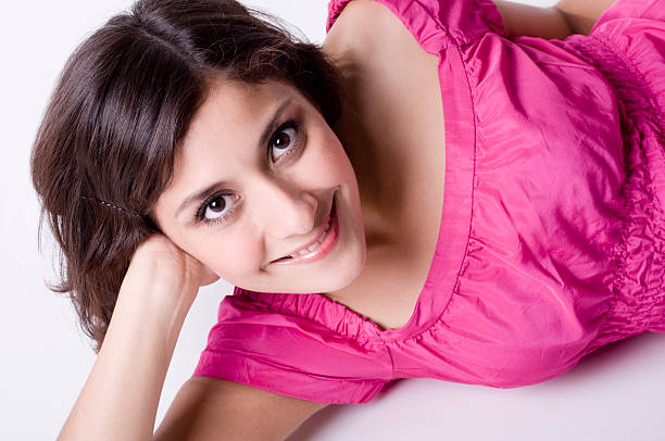 woman laying down smiling stock photo